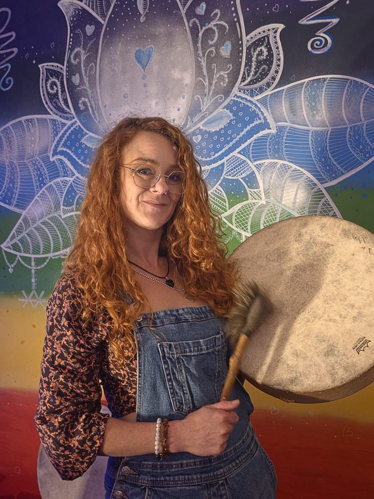 Fiona with a drum in the chakra room at The Healing Centre