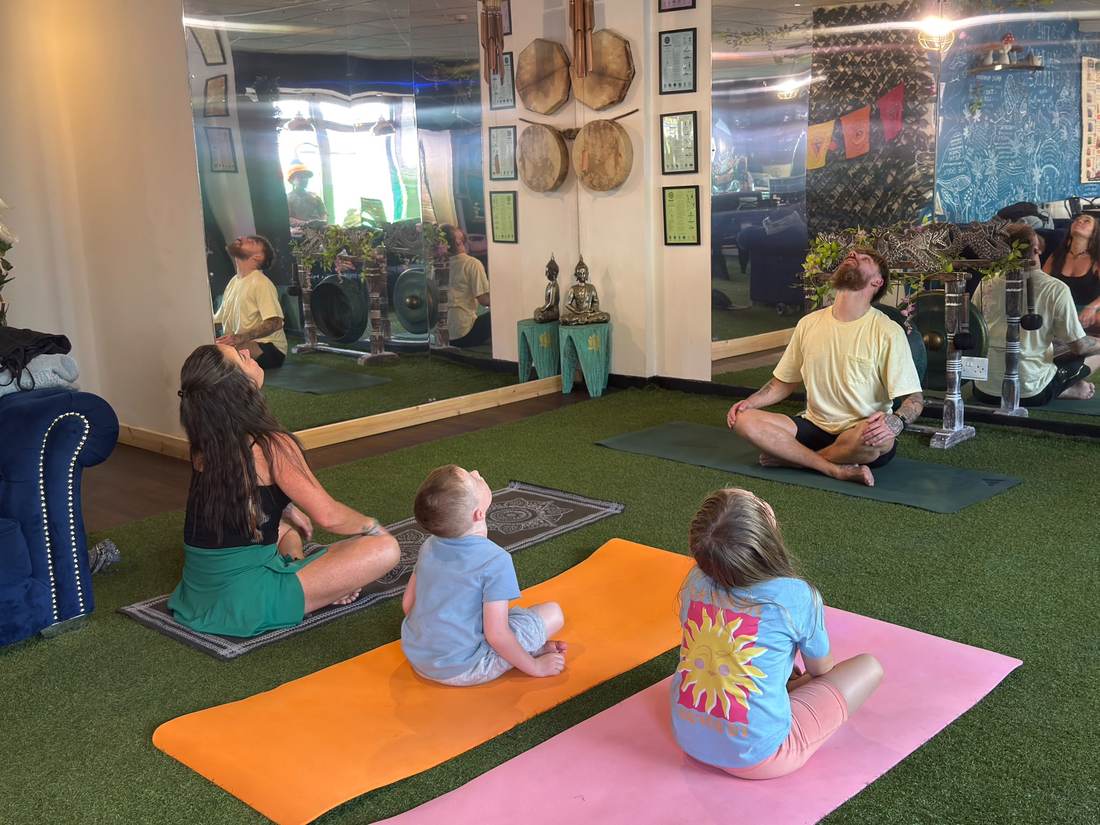 Nicky leading a family yoga class